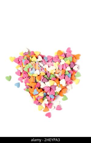 Multi-colored heart-shaped pastry topping in heart form on white background, minimalistic saint valentine`s day greeting card Stock Photo